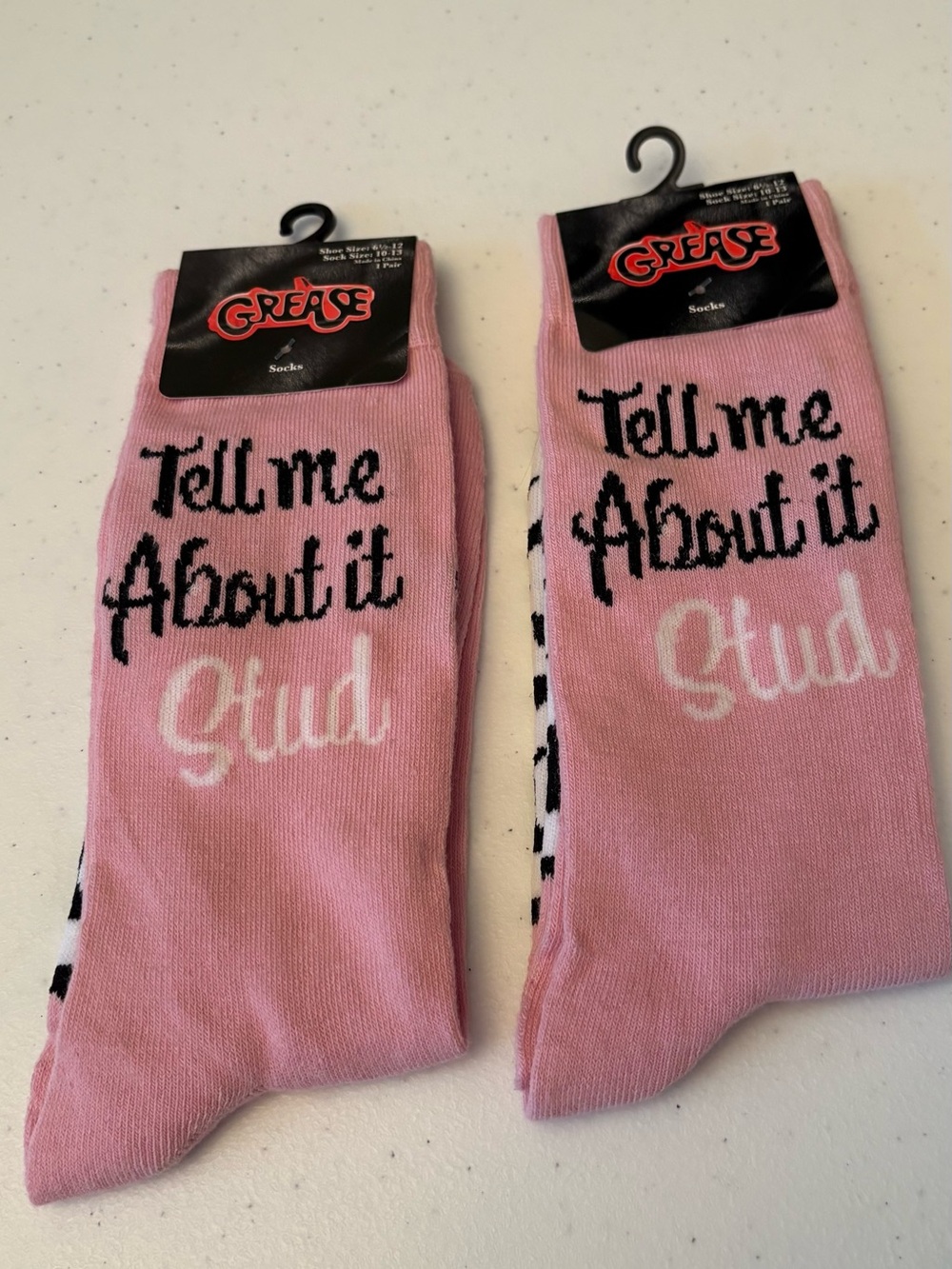 GREASE THE MOVIE SOCKS TWO PAIRS. “TELL ME ABOUT IT STUD“ SIZE 6 1/2–12